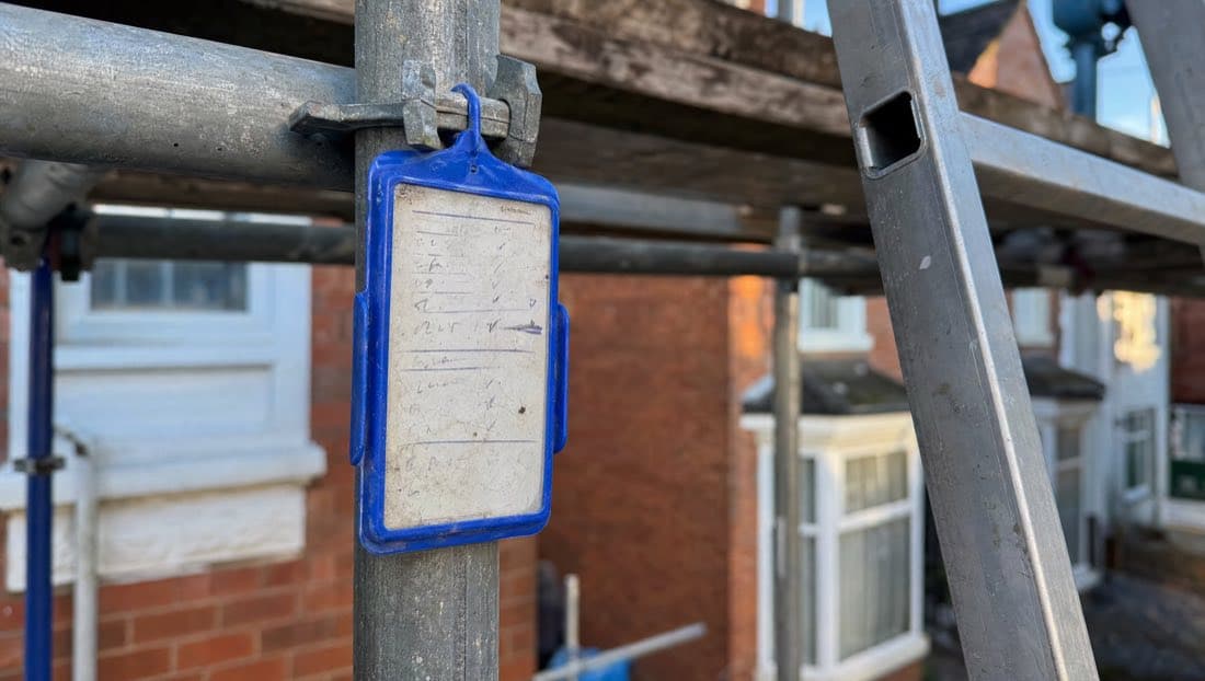 Scaffold inspection tag on a galvanised tube